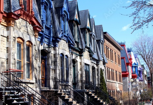 Beautiful colorful houses in Montreal, Canada, in the Plateau Mont Royal neighborhood popular with tourists, hipsters and artists.