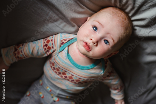 Cute young boy laying on the bed