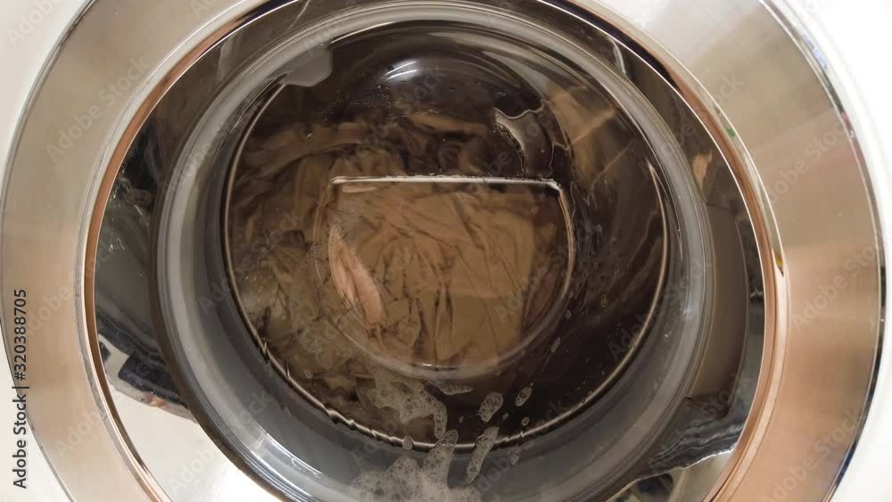 Washing machine spinning clothes. Fix camera. Washing machine spinning clothes. Fix camera.