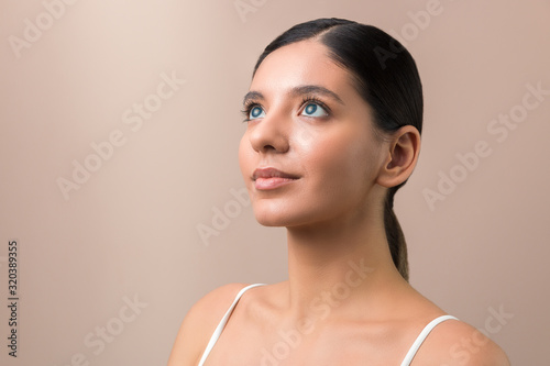 people of future. hypnotized beautiful woman with blue eyes staring up. high resolution photo