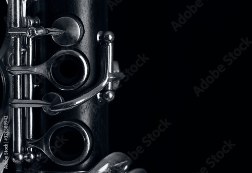 Leinwand Poster clarinet body on black background
