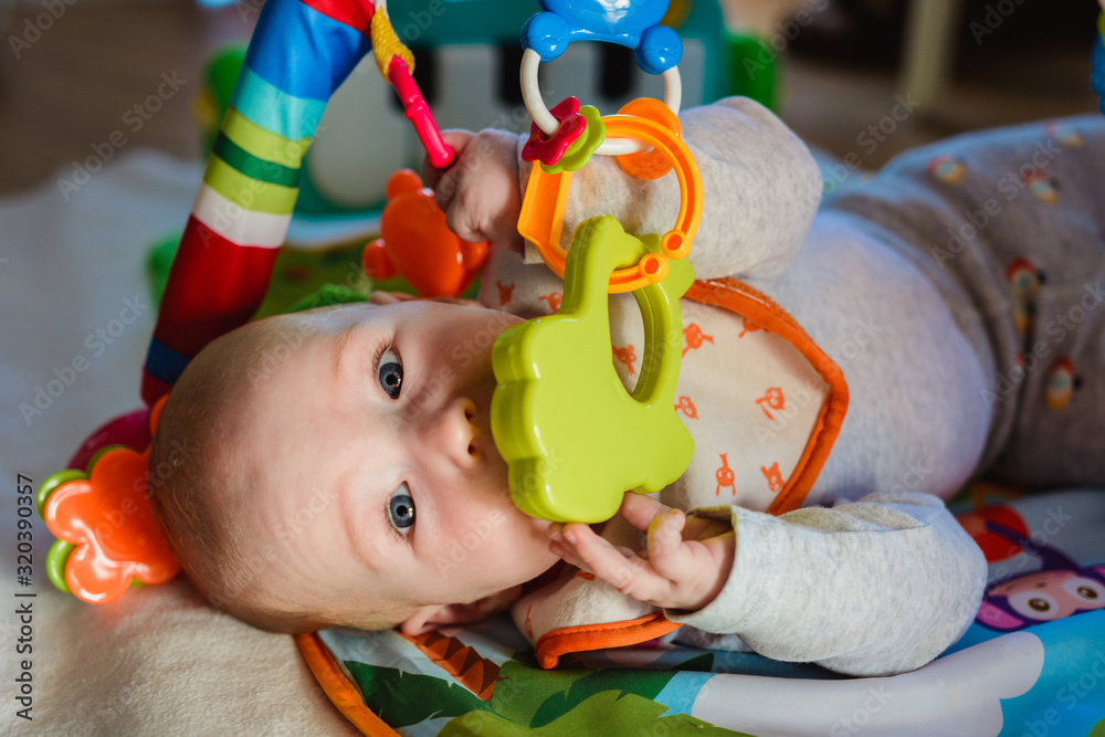 Young boy playing with toys.