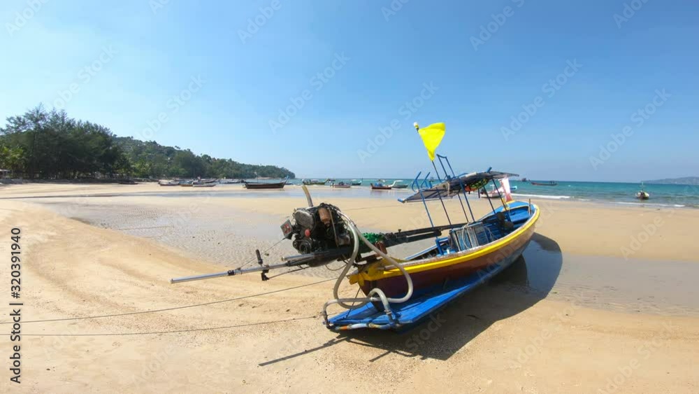 Seascape with old fisherman's and tourist boats at low tide in Thailand. Seascape with old fisherman's and tourist boats at low tide in Thailand.