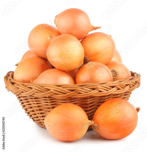 Onions in the basket isolated on the white background