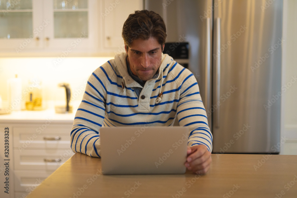 Young man using computer at home