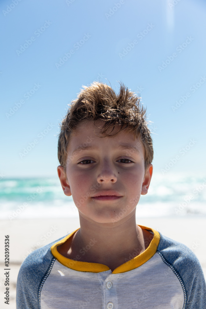 Boy looking at the camera at the beach Boy looking at the camera at the beach