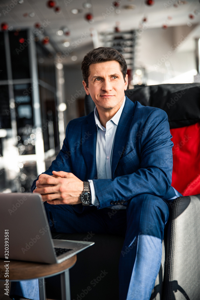 Handsome man with clasped hands looking away Handsome man with clasped hands looking away