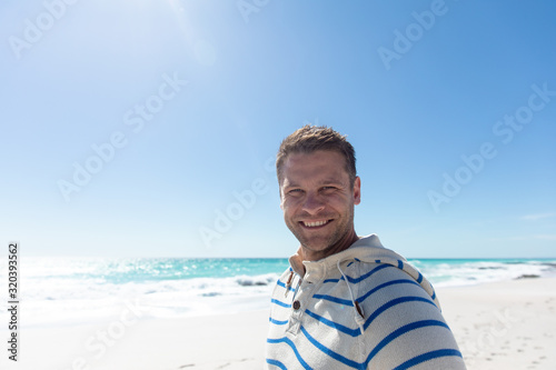 Man smiling at the beach #320393562