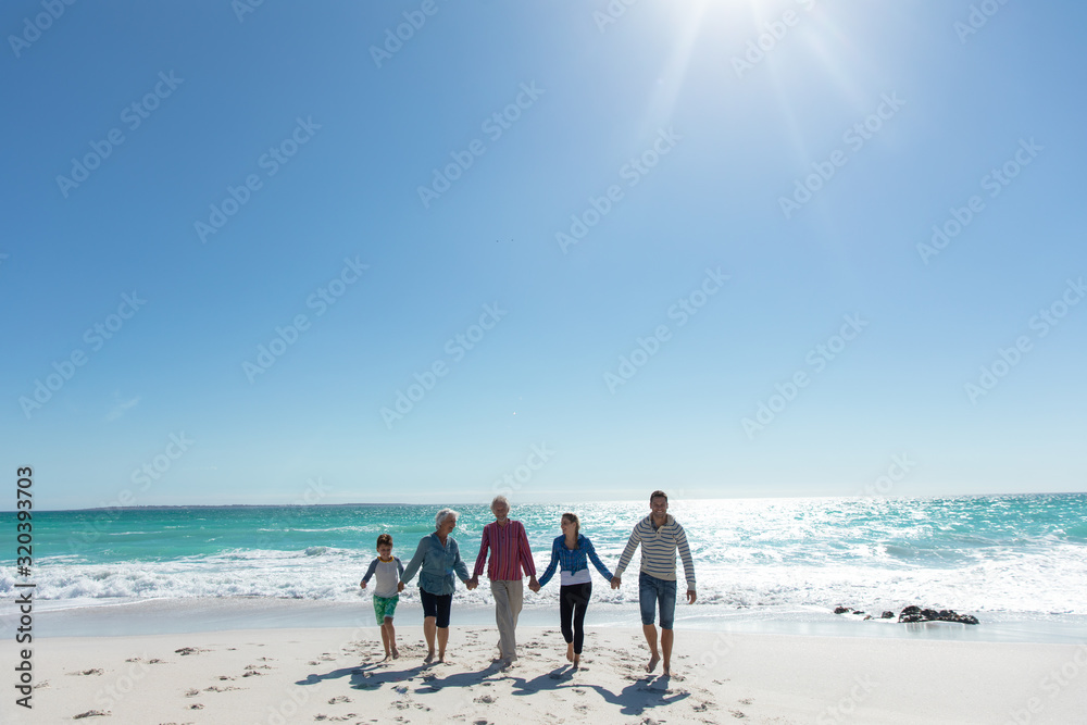 Family walking together at the beach