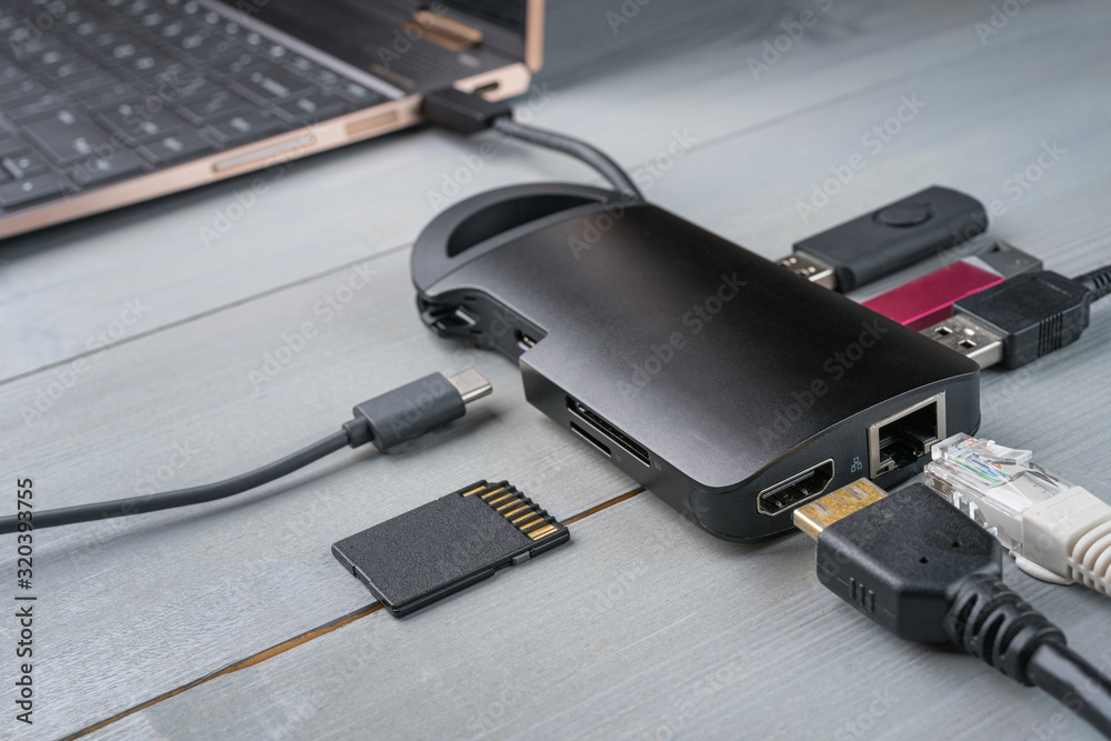 USB Type C adapter or hub with various accessories - pendrives, hdmi, ethernet, memory card, cables.