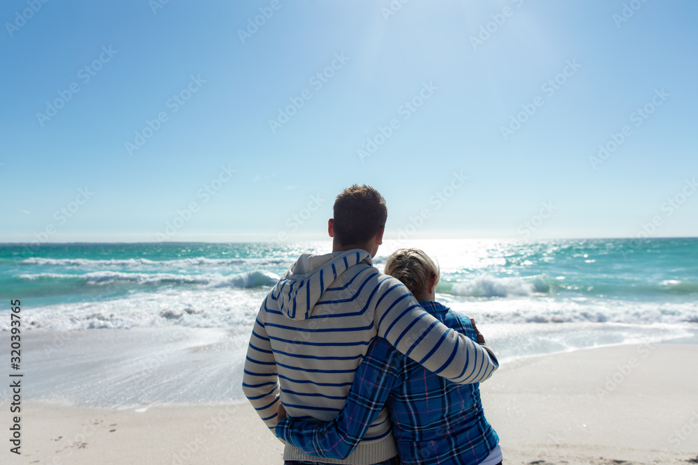 Couple hugging at the beach