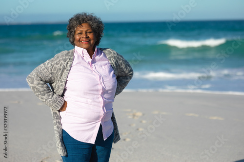 Old woman smiling at the beach #320393972