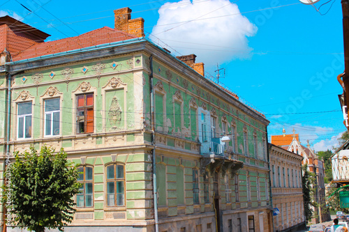 Fototapeta Naklejka Na Ścianę i Meble -  Berezhany, Ukraine - August 24, 2013: Old houses on the streets of a small Ukrainian city founded in 1375, now the population of the city is about 18 thousand people.