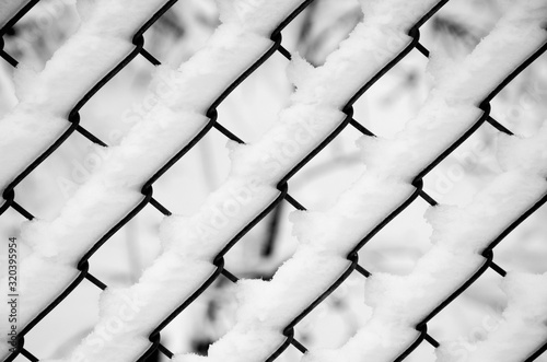 Abstract Fresh Winter Snow on Wired Fence Pattern