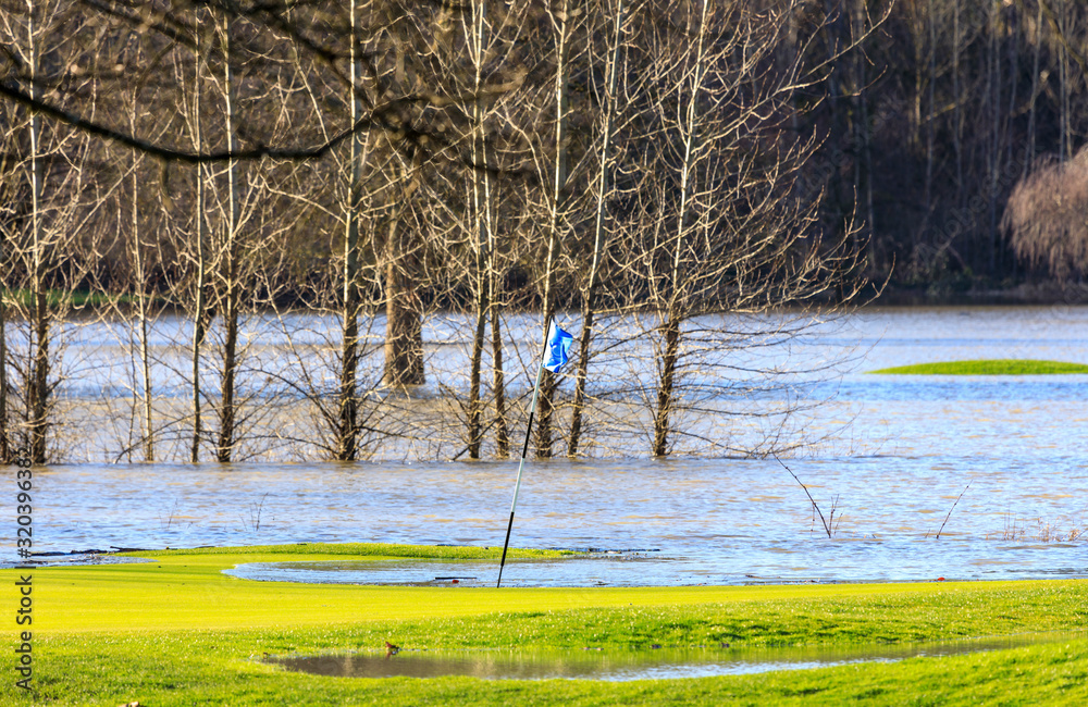 Golf course green flooded after extreme rainfall