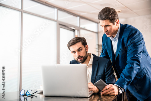 Two adult entrepreneurs working on a project
