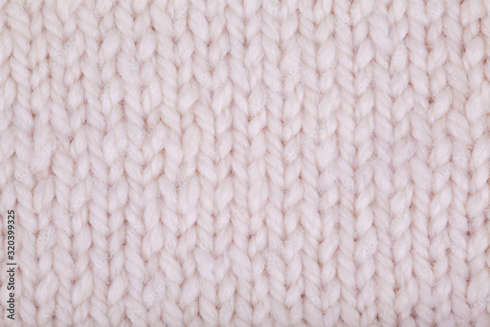 Knitted texture, woolen product, homework, hobbies, knitting, needlework. Close-up, background