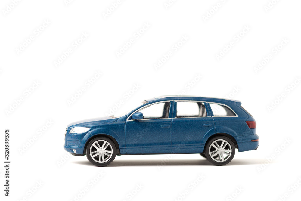 Blue iron toy car on a white background. SUV. copy space. sport utility vehicle