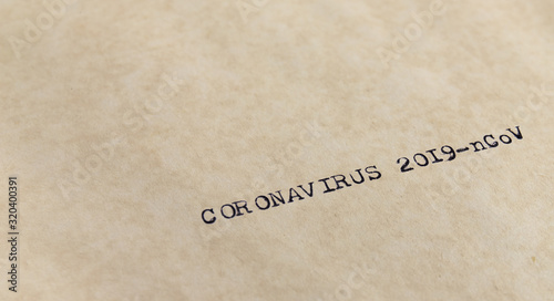 Coronavirus 2019-nCoV written with typewriter on old yellowish paper taken with narrow focus