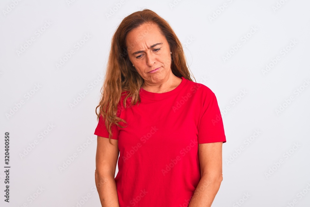 Middle age mature woman standing over white isolated background depressed and worry for distress, crying angry and afraid. Sad expression. Middle age mature woman standing over white isolated background depressed and worry for distress, crying angry and afraid. Sad expression.