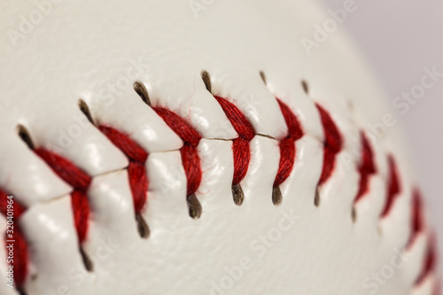 Macro close up of stitching on new baseball. 