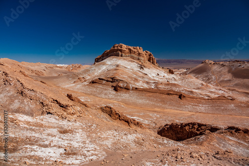 The dry, sandy and salty desert of Moon Valley with tracks
