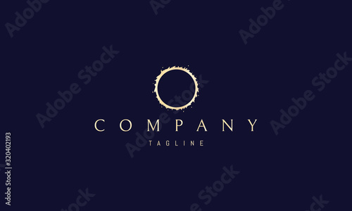 Golden vector logo on which the abstract image of an eclipse.