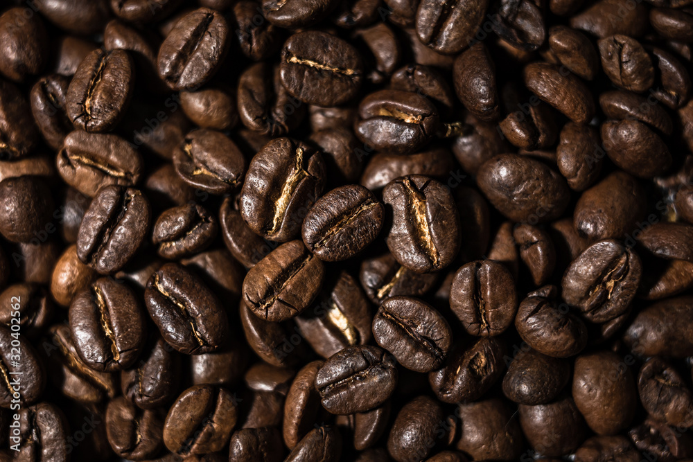 Macro image of coffee beans, small depth of field, selective focus Macro image of coffee beans, small depth of field, selective focus