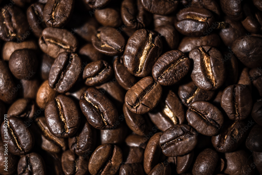 Macro image of coffee beans, small depth of field, selective focus Macro image of coffee beans, small depth of field, selective focus