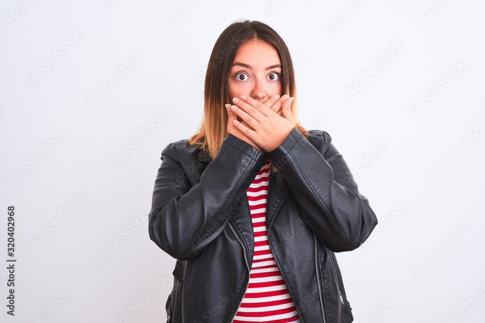 Young beautiful woman wearing striped shirt and jacket over isolated white background shocked covering mouth with hands for mistake. Secret concept. Young beautiful woman wearing striped shirt and jacket over isolated white background shocked covering mouth with hands for mistake. Secret concept.