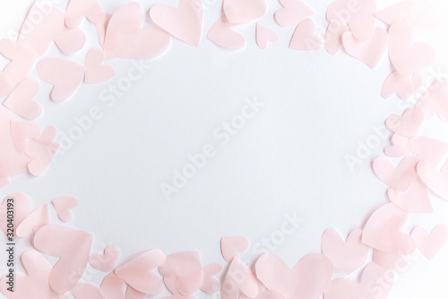 Cute pink pastel hearts frame on white paper  background with copy space. Flat lay. Happy valentines day. Pink paper heart cutouts on white backdrop, gentle image, greeting card. © sonyachny