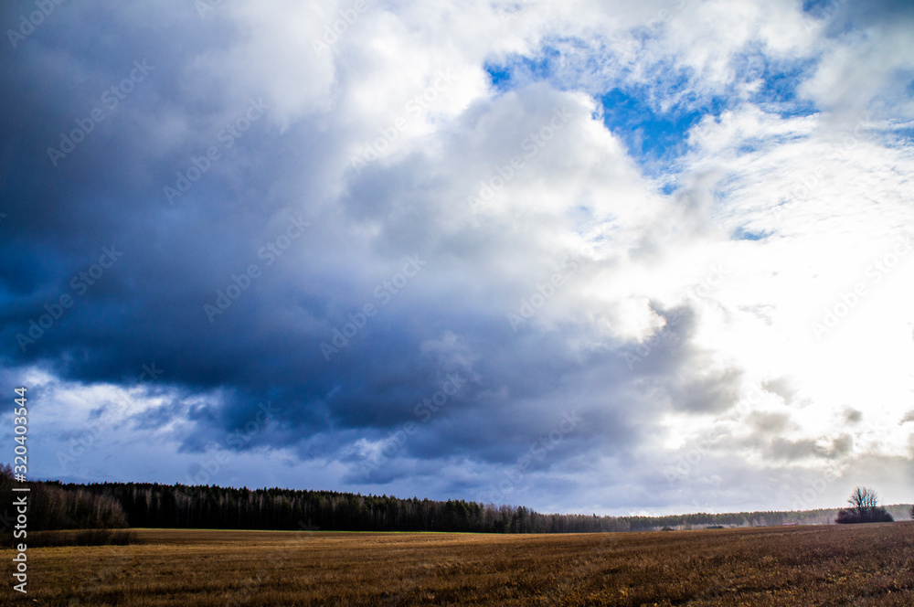Thunderstorm contrasting clouds in spring in the field Thunderstorm contrasting clouds in spring in the field
