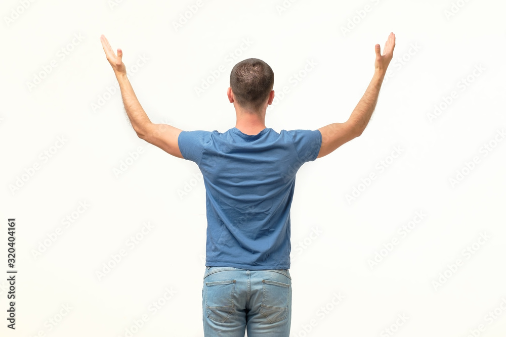 Casual man welcoming someone, isolated on white background. Rear view Casual man welcoming someone, isolated on white background. Rear view