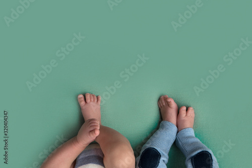 feet of twins newborns, brother and sister, multiple pregnancy. photo
