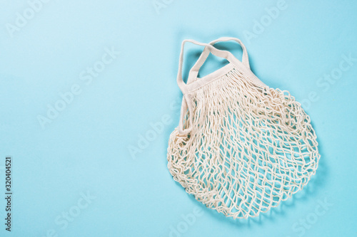 Mesh bag for zero waste shopping on color background.