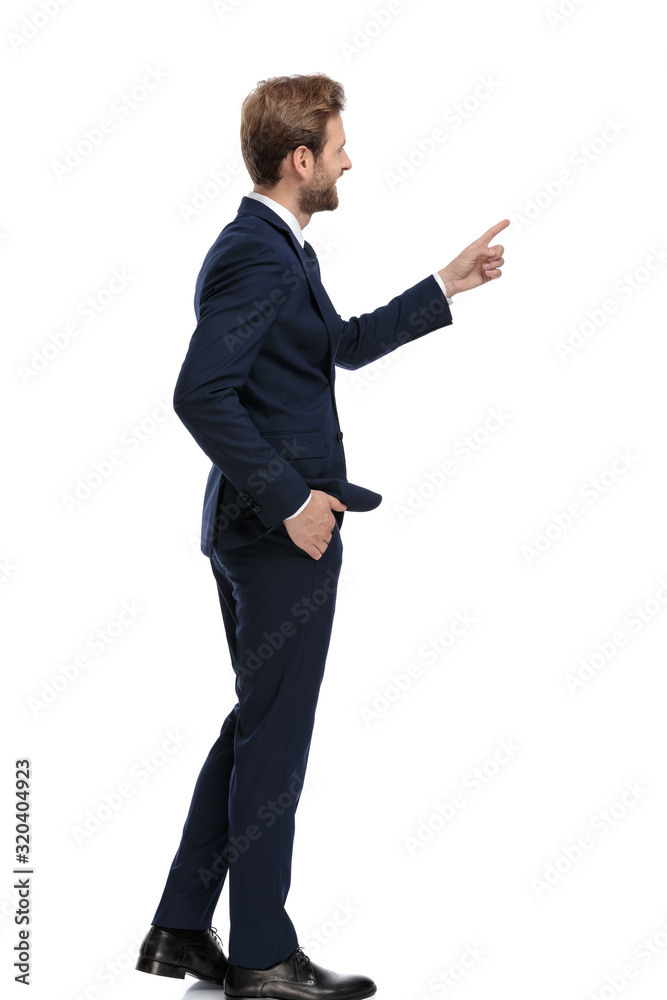 happy businessman in navy blue suit pointing finger happy businessman in navy blue suit pointing finger