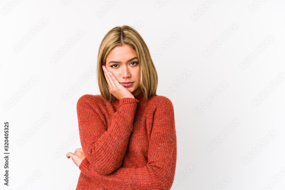 Young blonde caucasian woman isolated who is bored, fatigued and need a relax day. Young blonde caucasian woman isolated who is bored, fatigued and need a relax day.