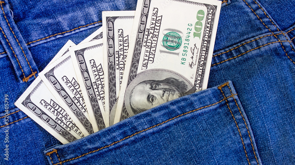 Money in the pocket of jeans. United States dollars Money in the pocket of jeans. United States dollars