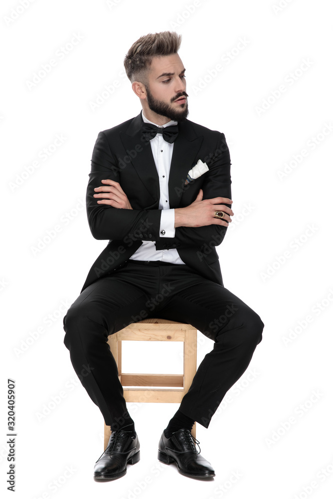 businessman sitting and looking aside suspicious businessman sitting and looking aside suspicious