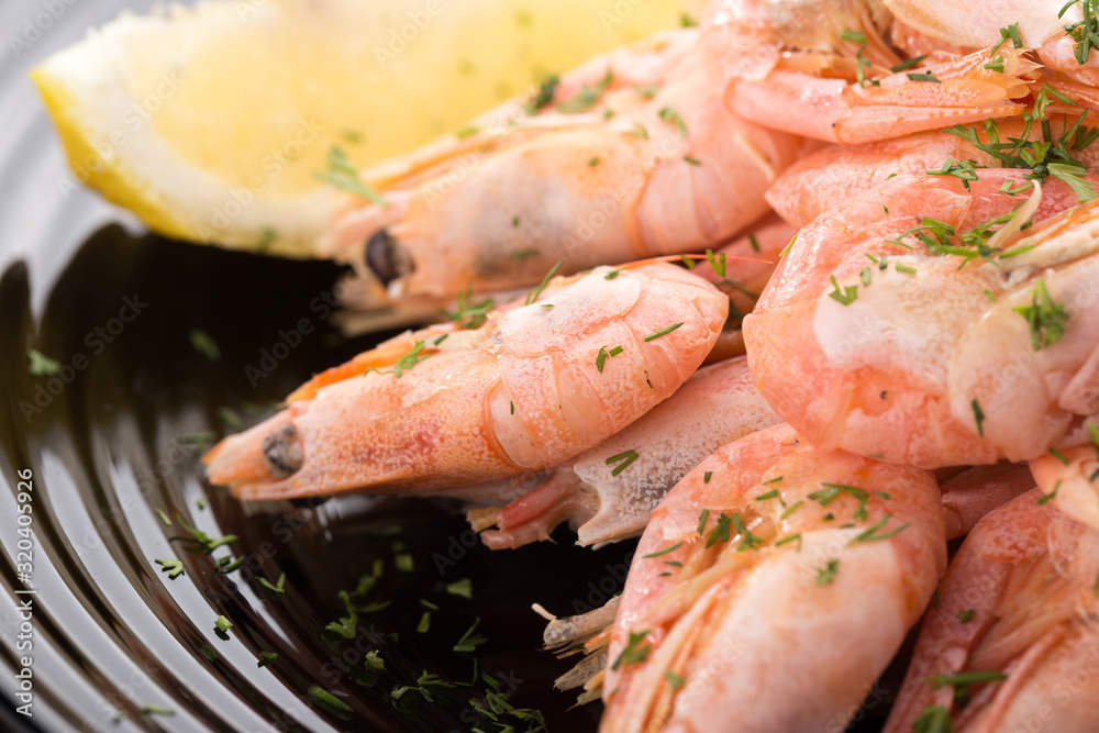 Shrimp on a plate Seafood, shelfish. Shrimps with herbs, garlic and lemon. Sea Food.