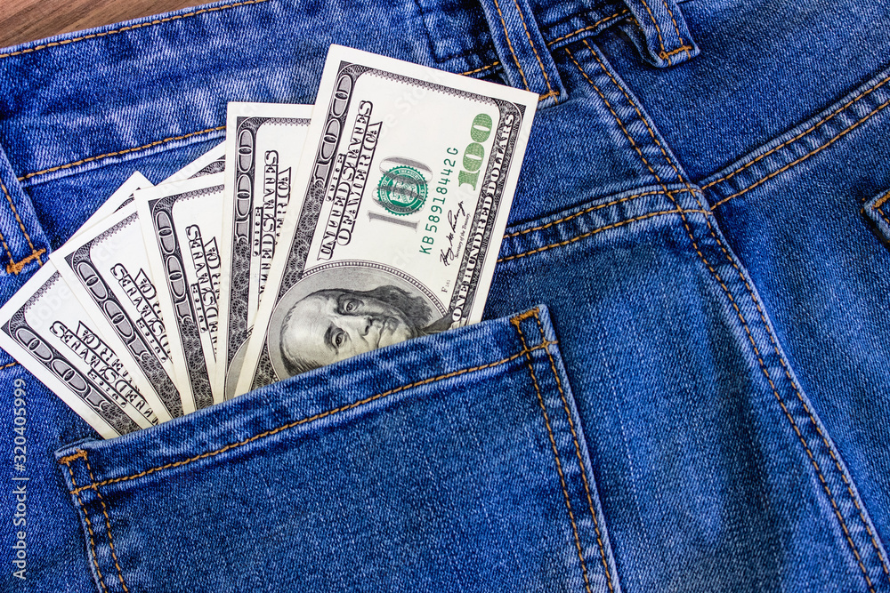 Money in the pocket of jeans. United States dollars Money in the pocket of jeans. United States dollars