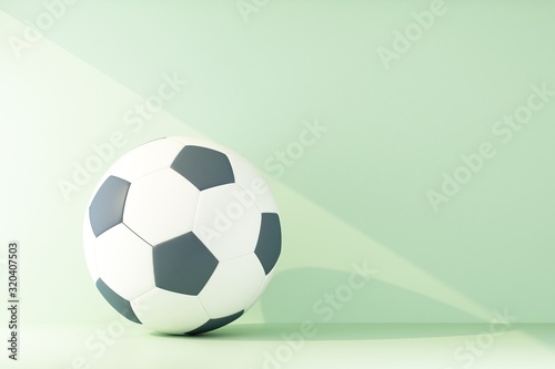 soccer ball lit by a ray of light