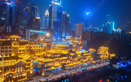City night view of Chongqing, China. The scenery by the river. The fusion of modern architecture and folk architecture. City view by the water