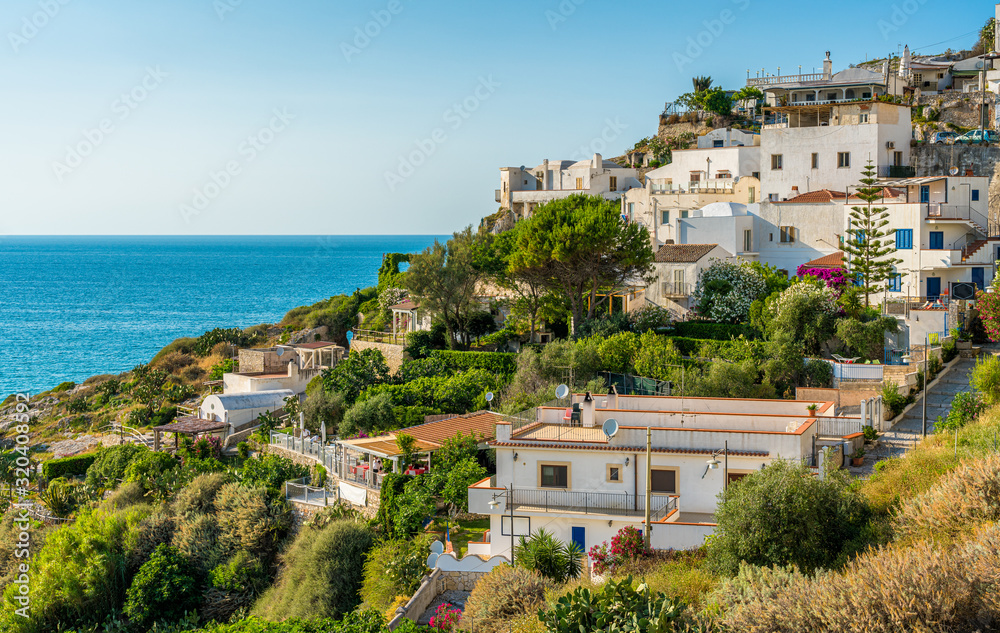 Summer afternoon view in Peschici, beautiful village in the Gargano region of Puglia (Apulia), Italy. Summer afternoon view in Peschici, beautiful village in the Gargano region of Puglia (Apulia), Italy.