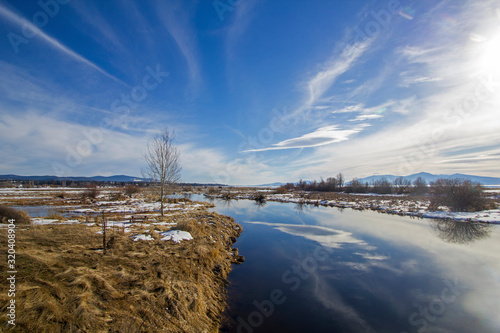 Winter view at Klamath NWR with clouds reflected in water