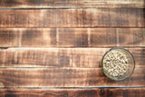 sunflower seeds in a glass Cup on a wooden background