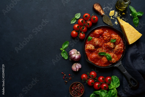 Spicy meatballs in tomato sauce. Top view with copy space.