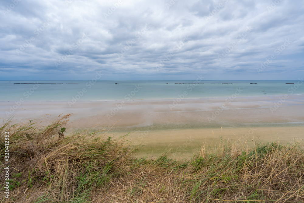 Arromanches, France - 08 16 2019:  View of the Landing Beach from the cliffs