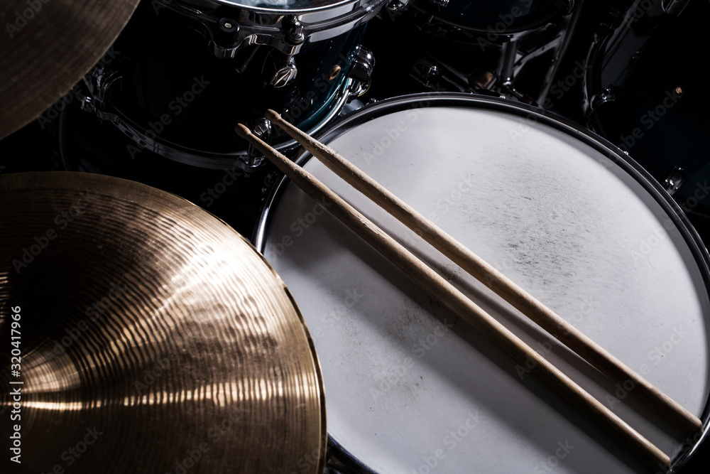 Closeup of drumsticks lying on the drum set Closeup of drumsticks lying on the drum set