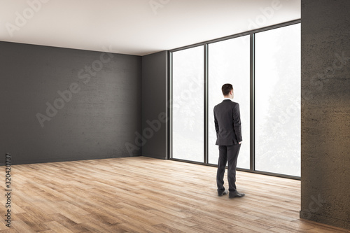 Businessman standing in modern interior